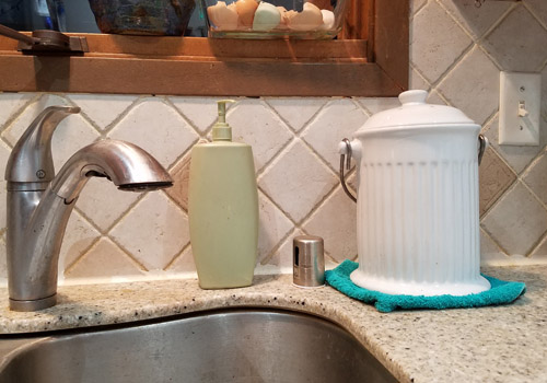 white ceramic kitchen compost holder