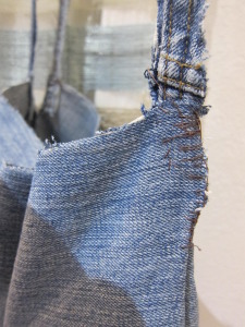 sewing the hanging strap on a denim planter