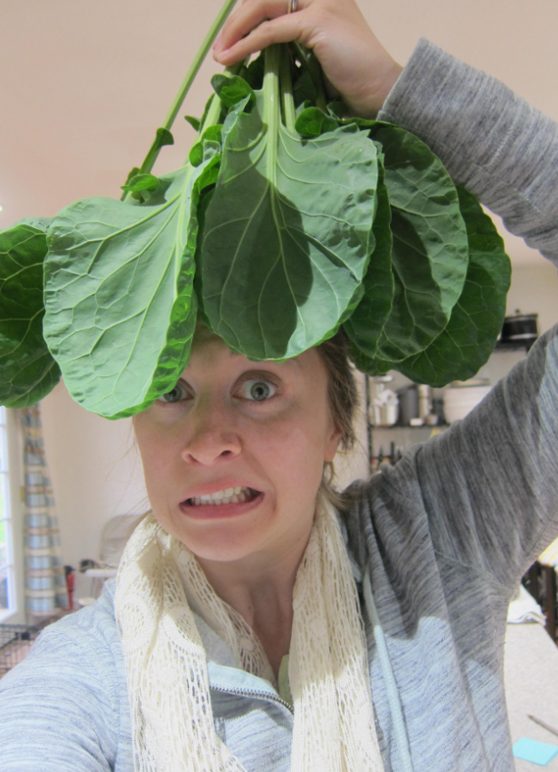 brussels sprout leafy greens on woman's head