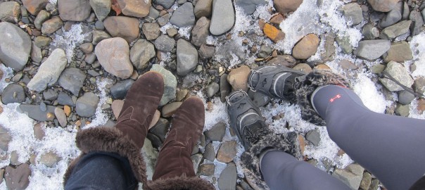 women's boots standing on rocks