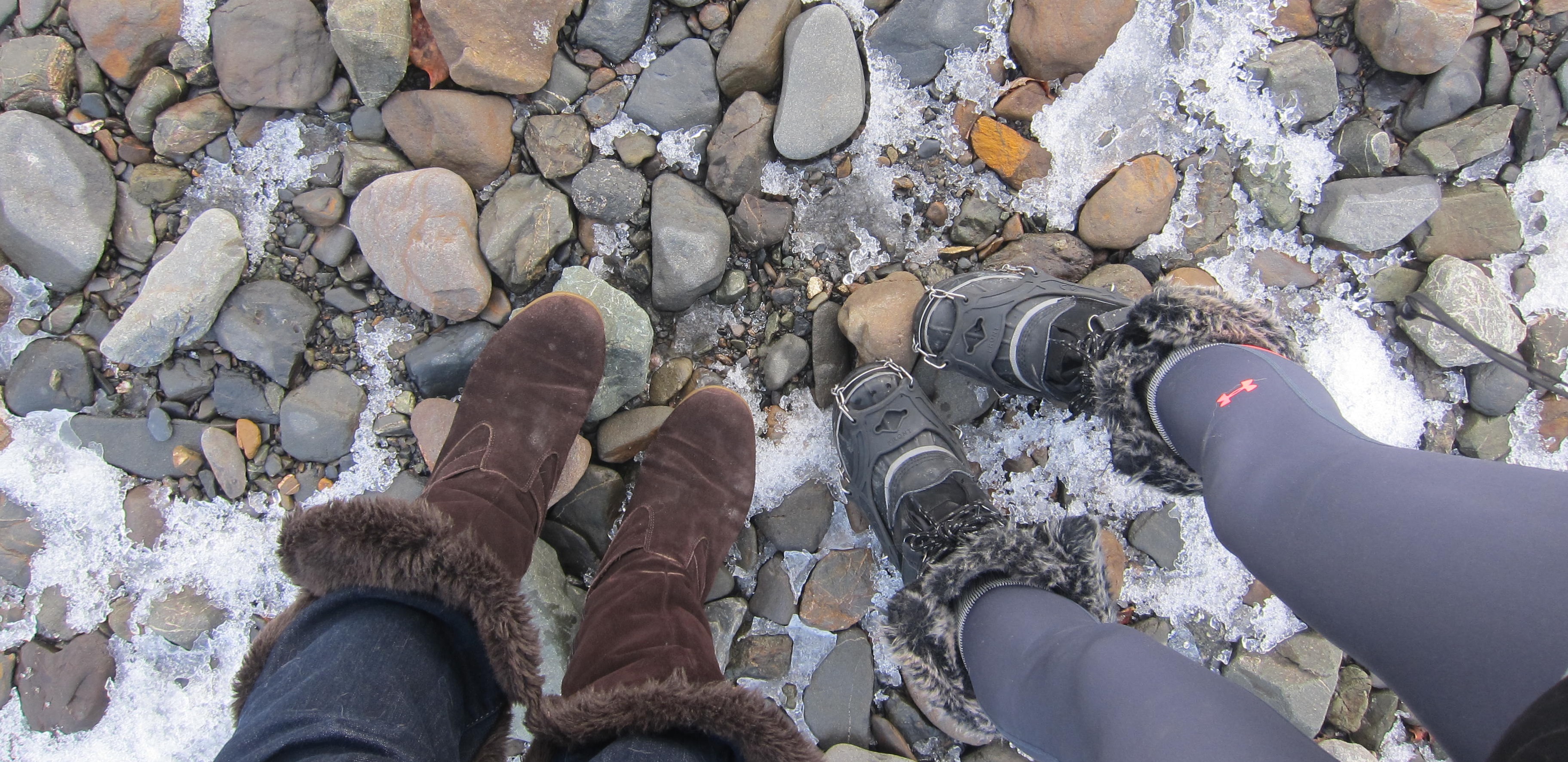 women's boots standing on rocks