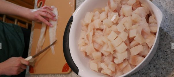 dicing raw halibut filets